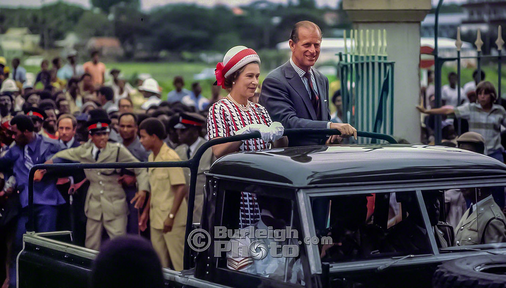 Queen Elizabeth and Prince Philip ride in a Land Rover to meet the people at Queen's Park, Silver Jubilee, Barbados 1977 bgv07-05