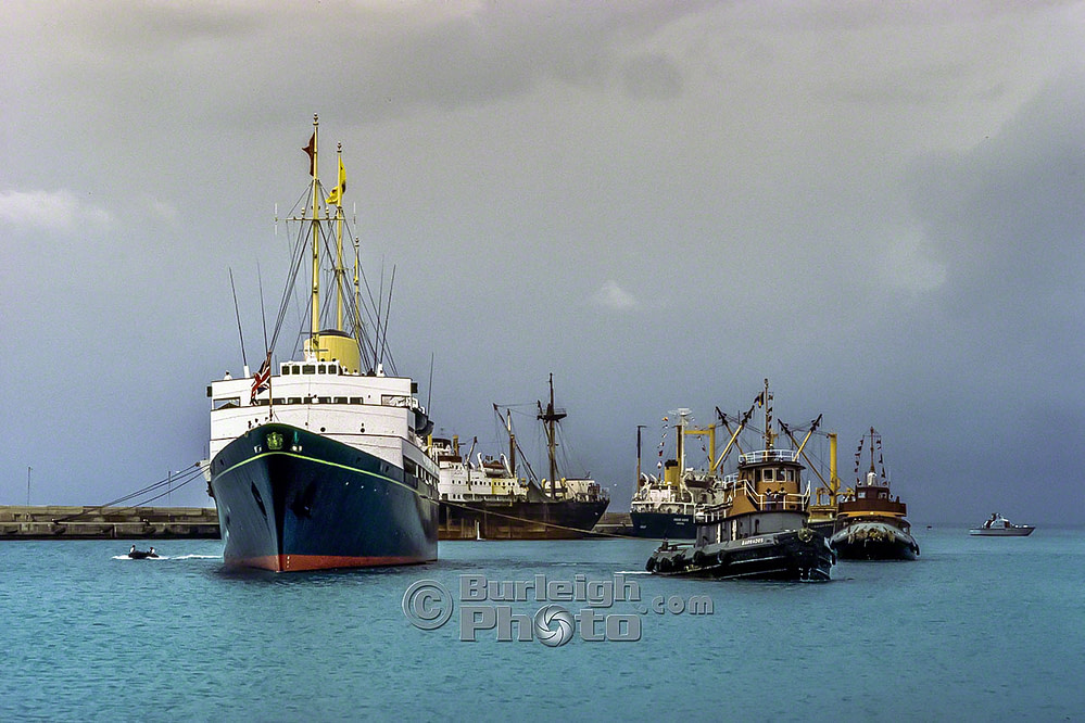 The tugs Barbados and Pelican bring HMY Britannia is brought into Bridgetown Deepwater Harbour, Silver Jubilee, 1977