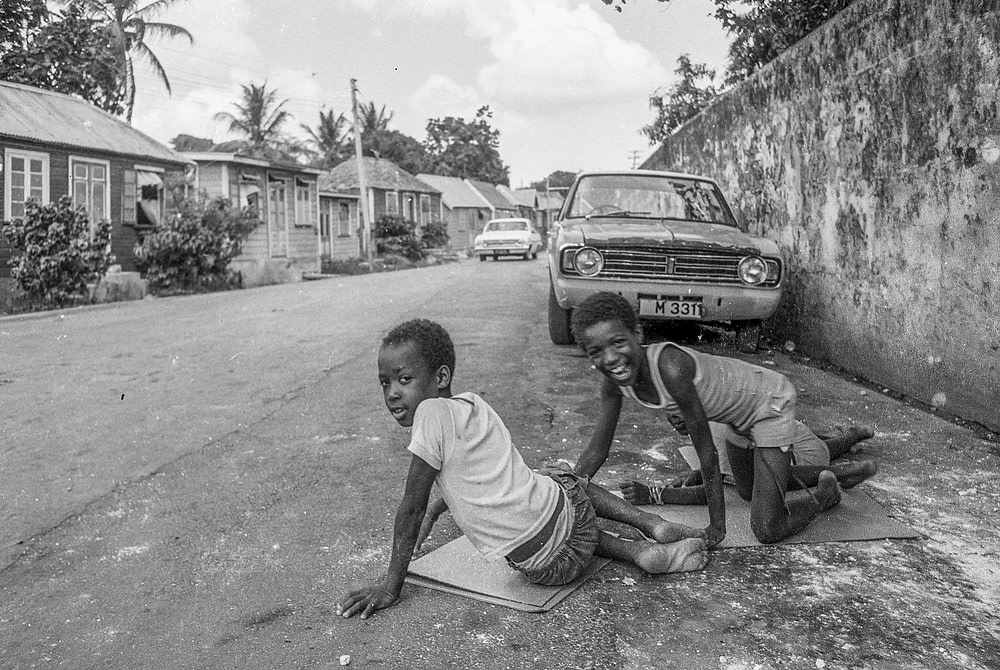 Boys play on a quite street in Bridgetown