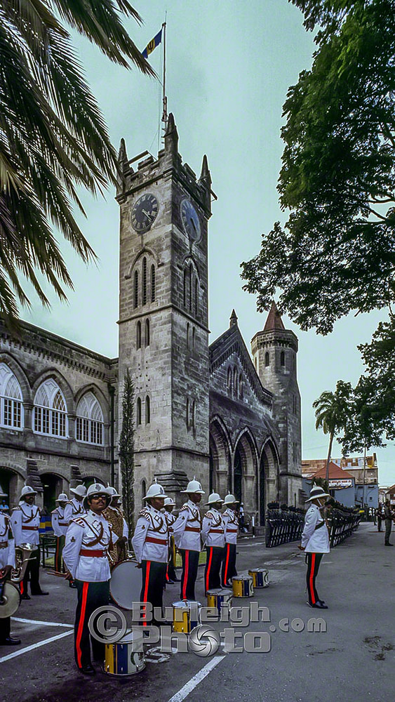 The Royal Barbados Police Band await the arrival of Queen Elizabeth at the Public Buildings, Bridgetown, Barbados