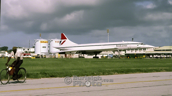 A contrast in technologies - a cyclist crosses the runway as Concorde is prepared for takeoff bgv12-05